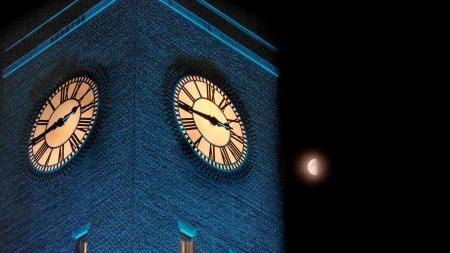 The Bell Tower lit up with blue lights.